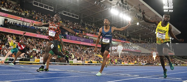 Ferdinand Omanyala of Kenya celebrating his win as Benjamin Azamati (right) is pipped at the finish line by Yupun Abeykoon